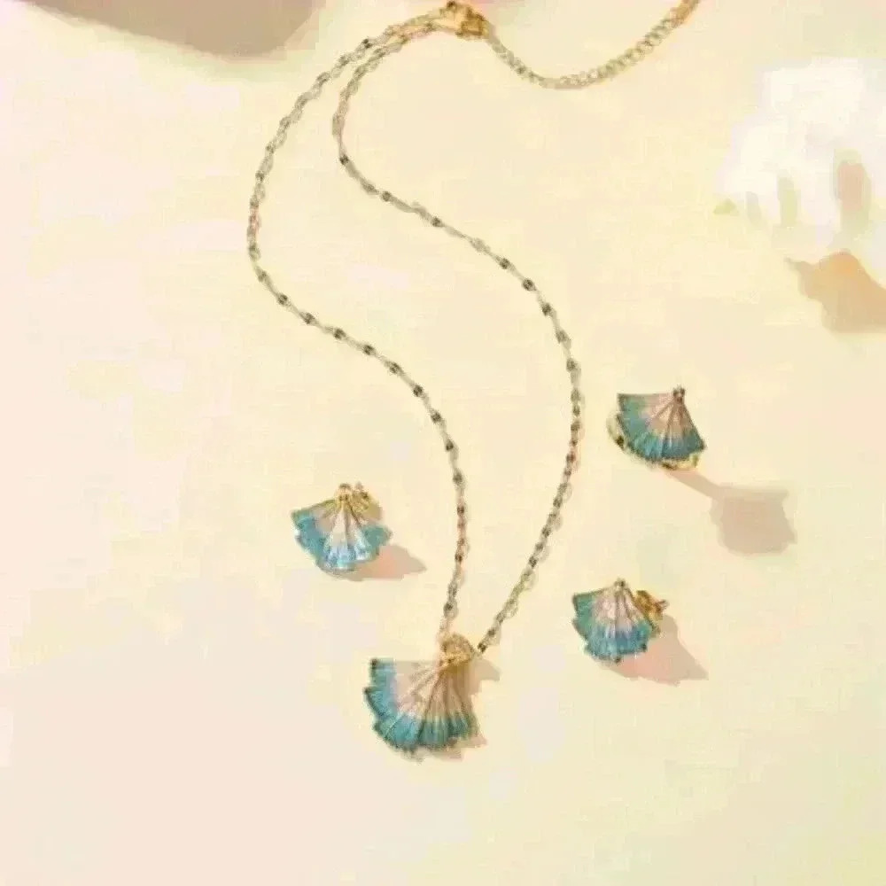 Delicate Fan-Shaped Pendant Accented with Shimmering Blue Hues